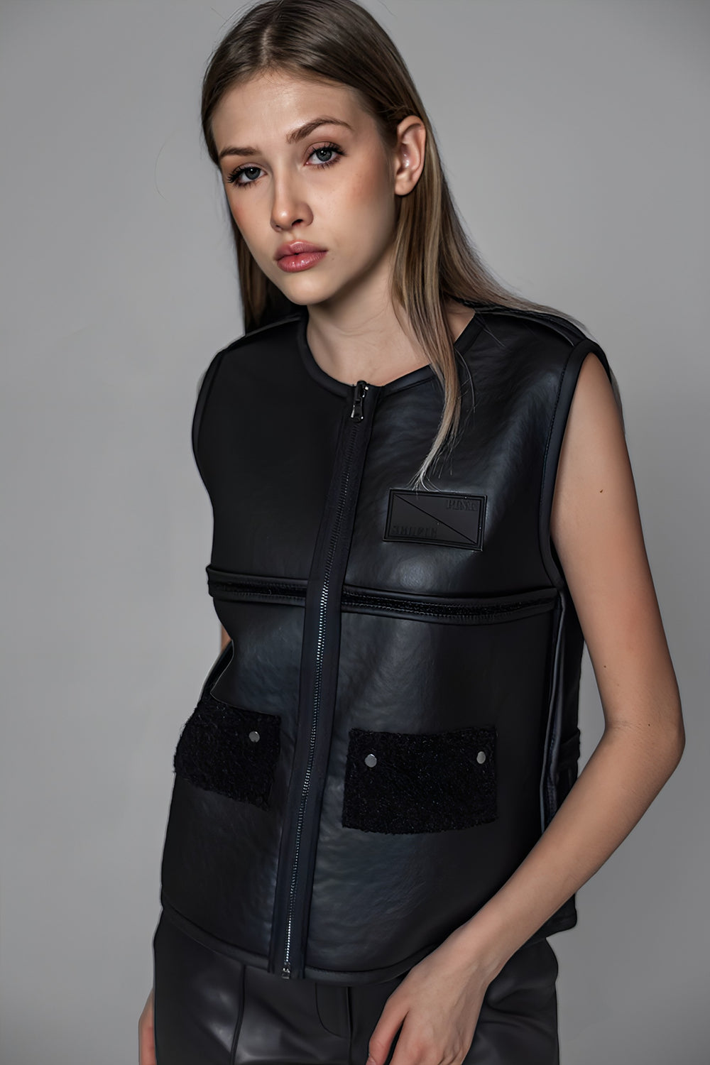 BLACK TEXTURED FUR AND LEATHER REVERSIBLE VEST