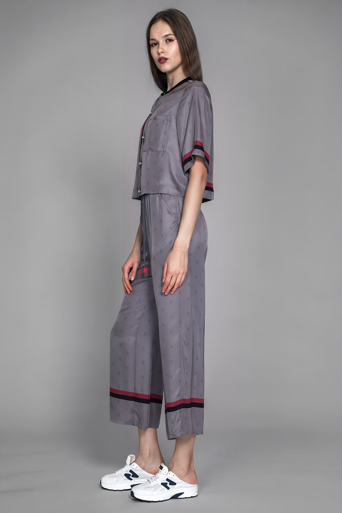 
                  
                    LOTUS GREY/BROWN LOGO PRINT LOOSE LONG PANTS
                  
                