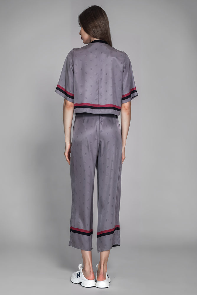 
                  
                    LOTUS GREY/BROWN LOGO PRINT LOOSE LONG PANTS
                  
                