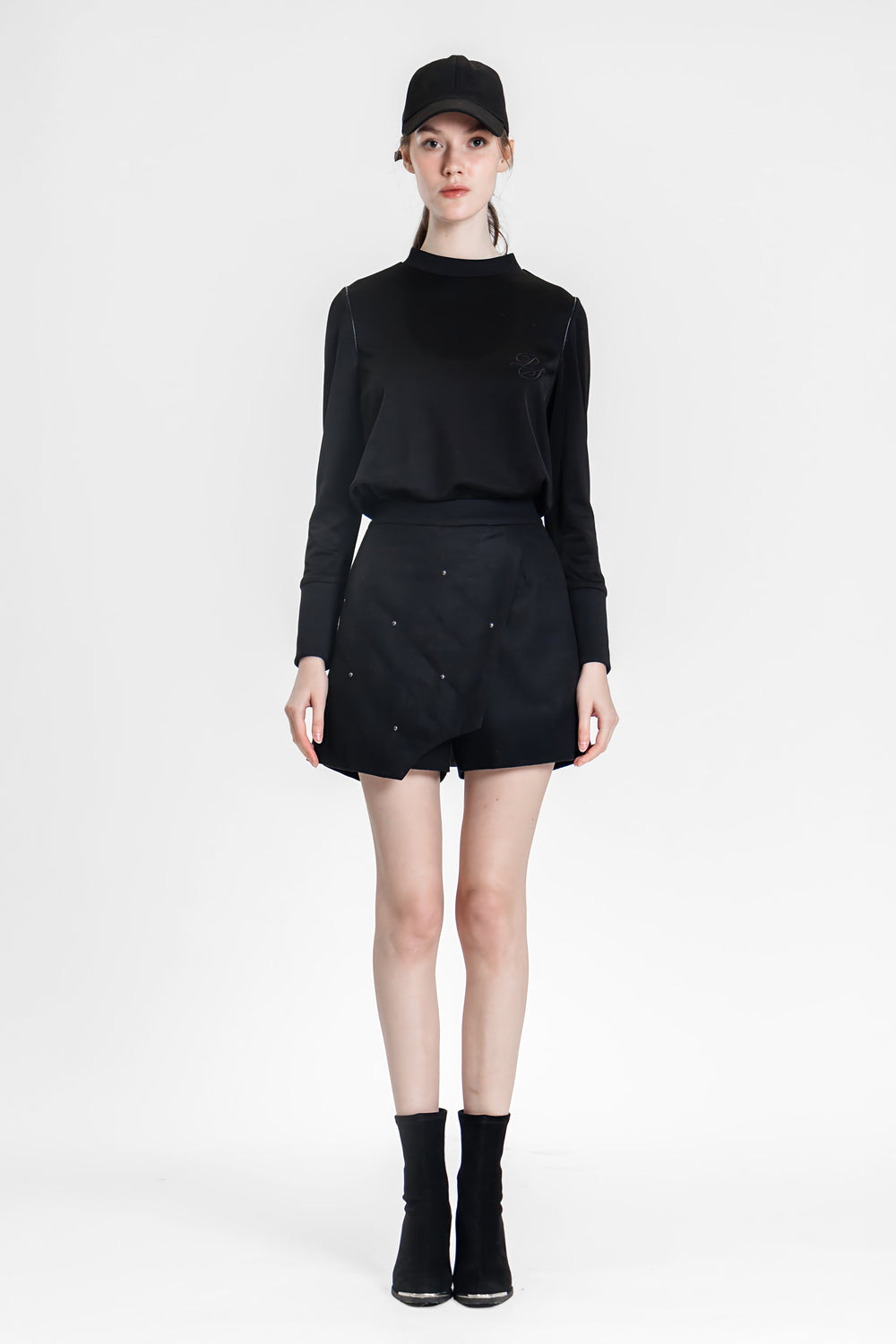 BLACK ASYMMETRICAL DESIGN WITH BUTTONS SHORTS