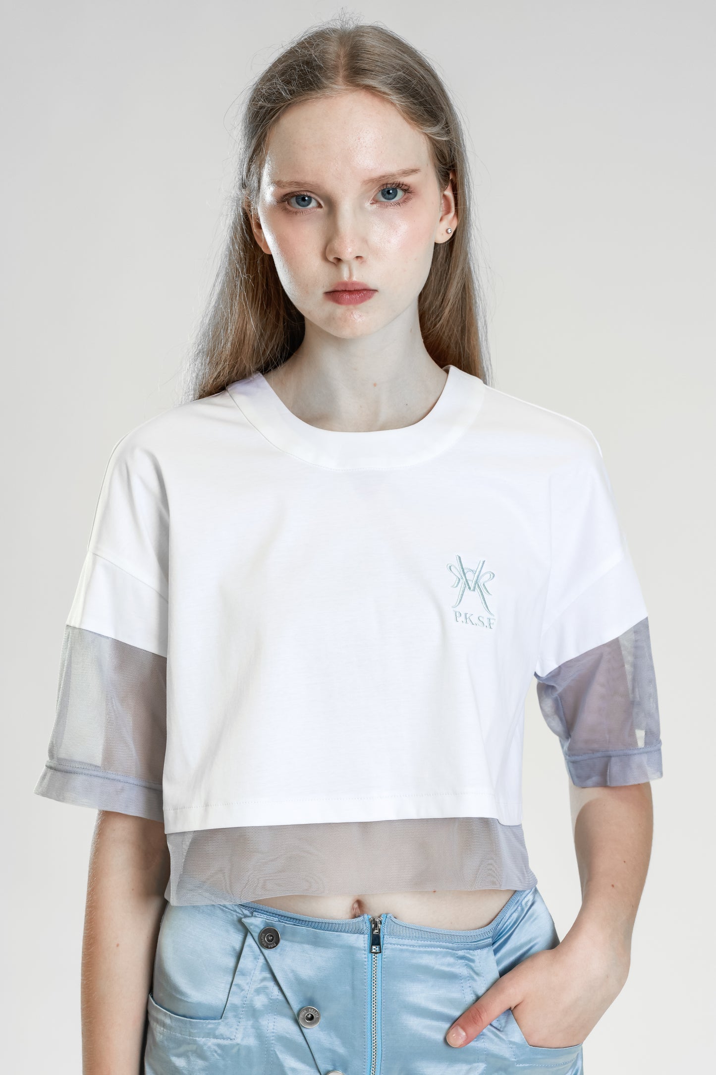 
                  
                    WHITE COTTON PANELING WITH PINK SKIN / LIGHT BLUE MESH THREE-QUARTER CROPPED TEE
                  
                